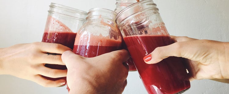 hands-mason-jars-beetroot-juice