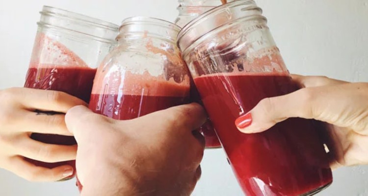 hands-mason-jars-beetroot-juice