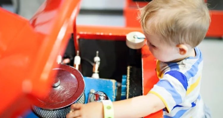 toddler-boy-pretending-to-fix-the-engine-on-a-car_t20_Ko4KG0 (1)